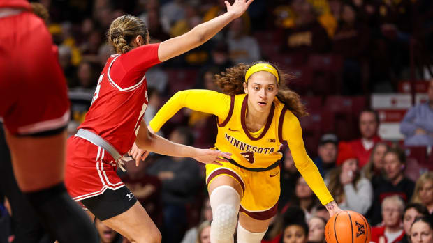 Feb 20, 2024; Minneapolis, Minnesota, USA; Minnesota Golden Gophers forward Ayianna Johnson (1) works around Wisconsin Badgers guard Sania Copeland (15) during the first half at Williams Arena.